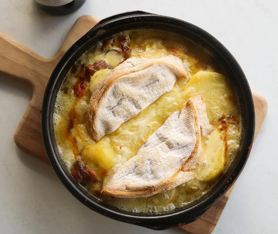 cooked tartiflette in a baking dish
